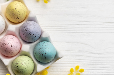 Colorful easter eggs  and mimosa flowers on wooden table., a Holiday Photo by Olena Rudo