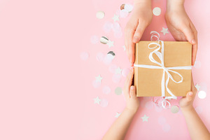 Hands giving paper gift box, a Holiday Photo by Lenor4ik