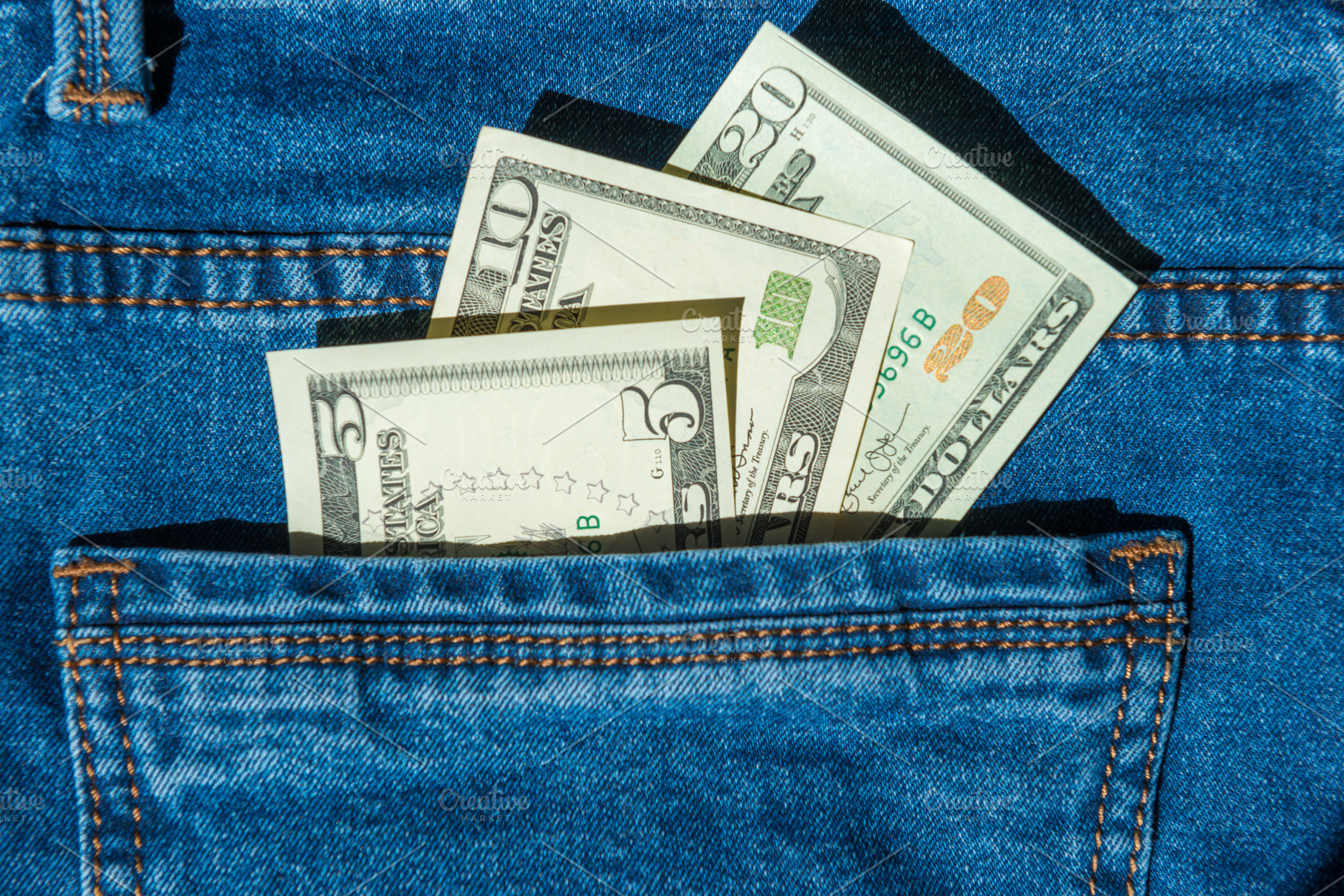 Money in blue jeans pocket, a Business Photo by Vapi
