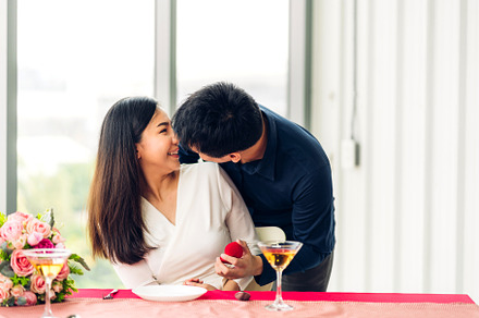 Young handsome man giving ring for surprise to girlfriend and ta, a Person Photo by Art_Photo