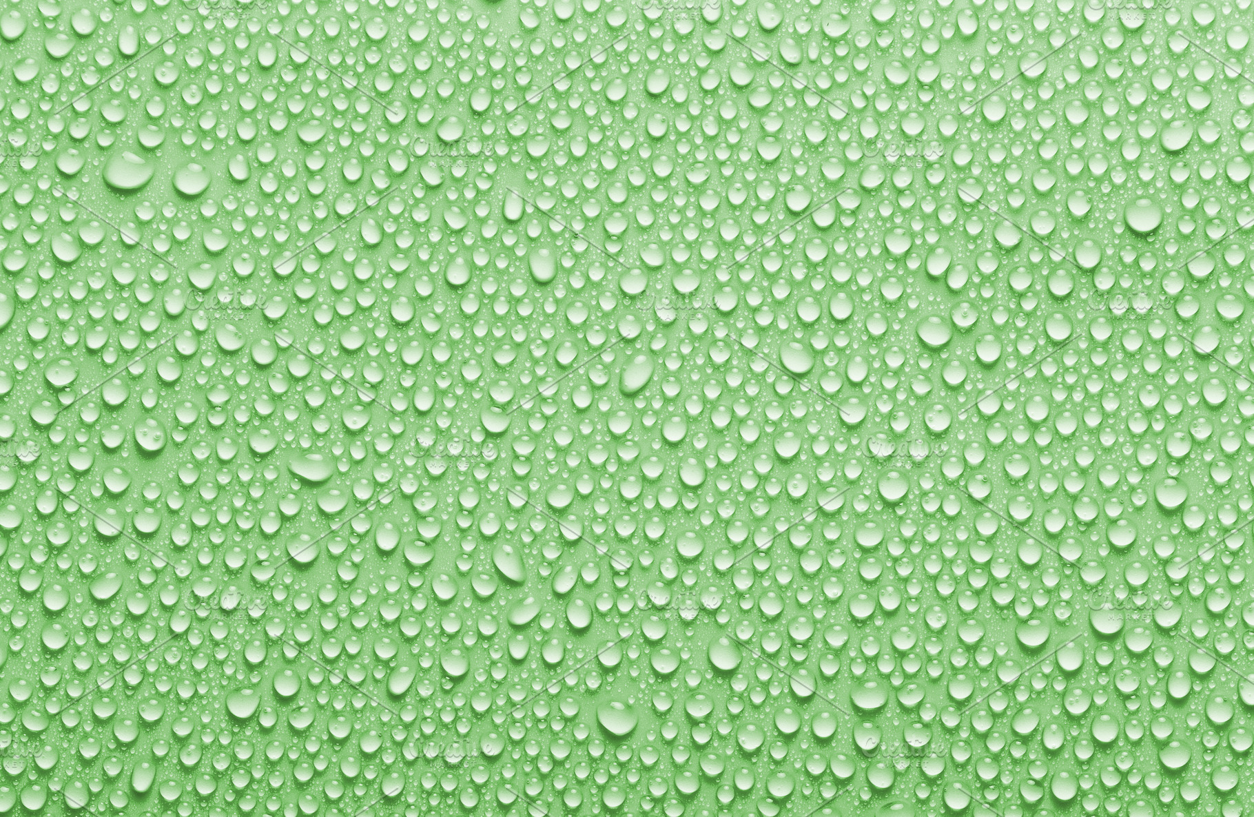 Green colored rain drops background, an Abstract Photo by BOOCYS