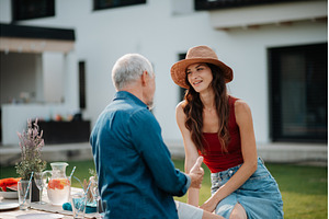Senior father with daughter outdoors, a Person Photo by HalfPoint