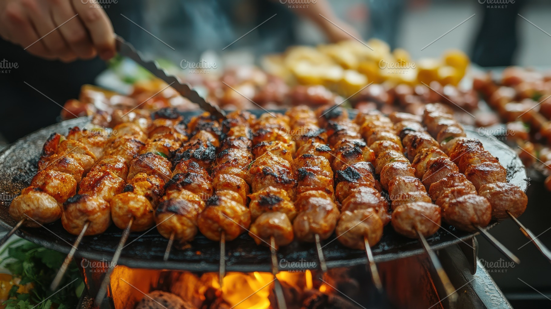 Skewers grilling over an open fire,, a Background Photo by Pixeness