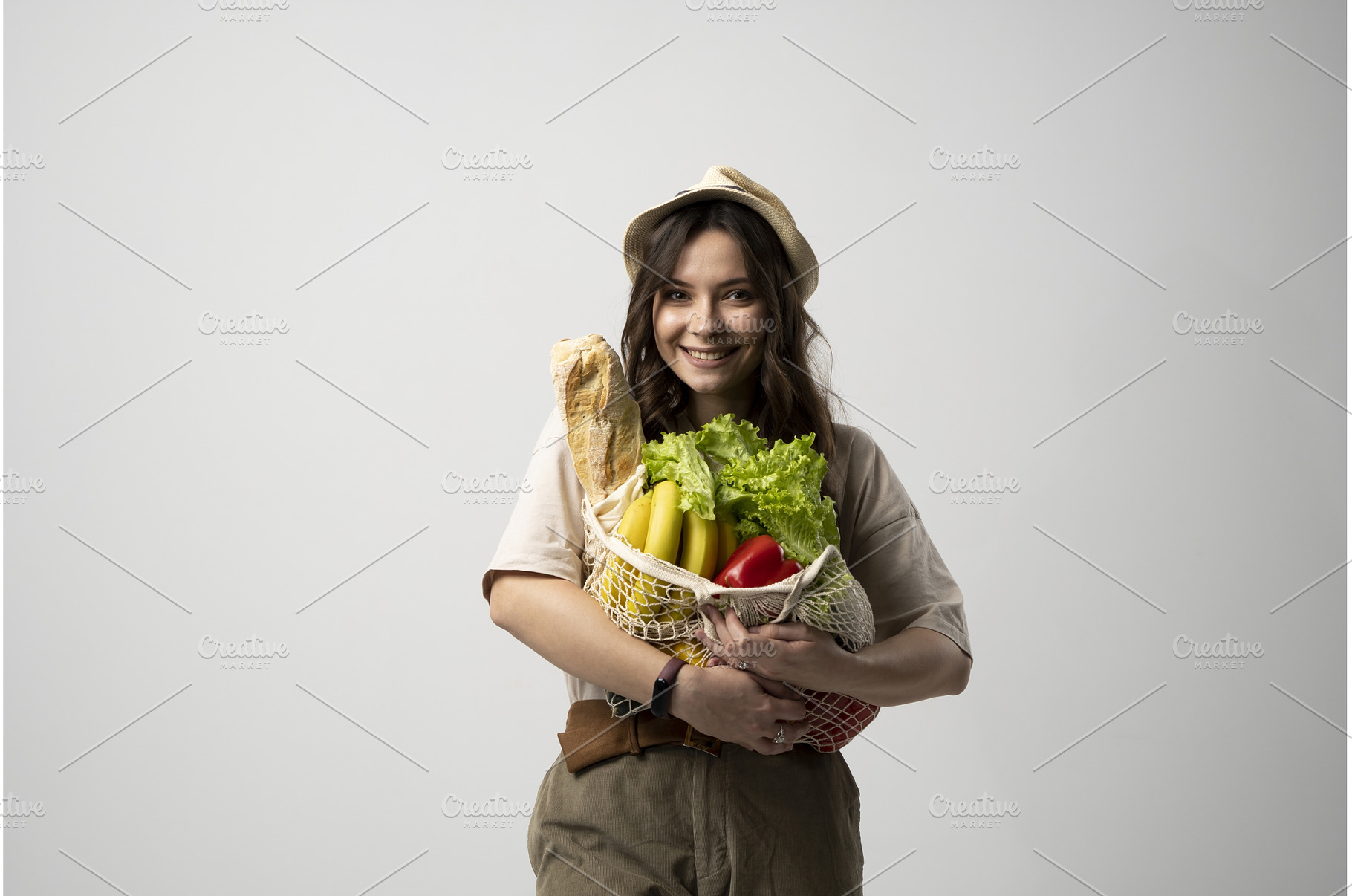 Woman holding cotton grocery bag, a Food & Drink Photo by volodymyrshtun13795