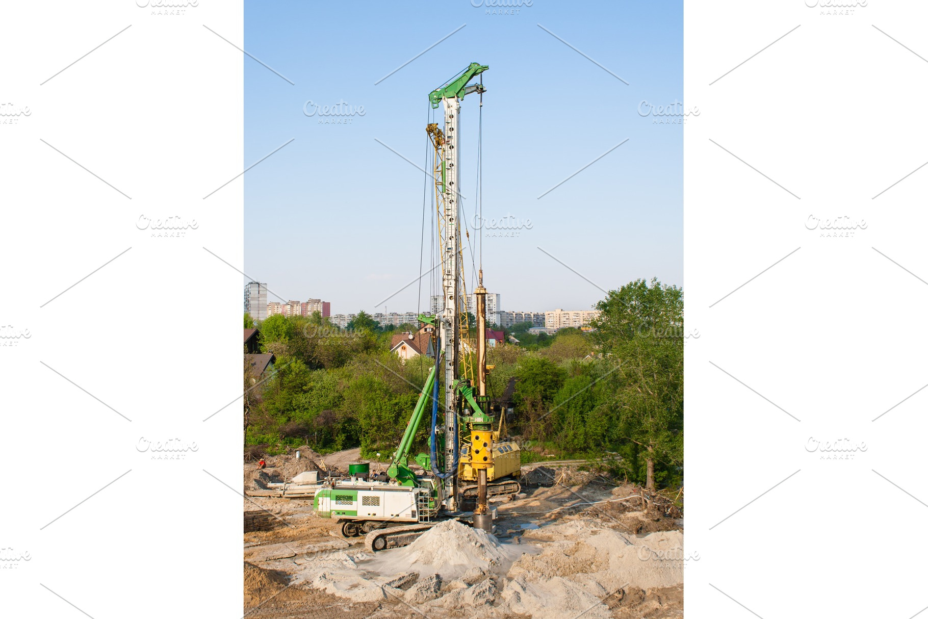 Pile driver at a construction site containing pile, ukraine, and driver, an Industrial Photo by Leonid Andronov
