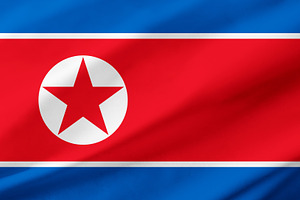 North Korea flag background with waving fabric texture