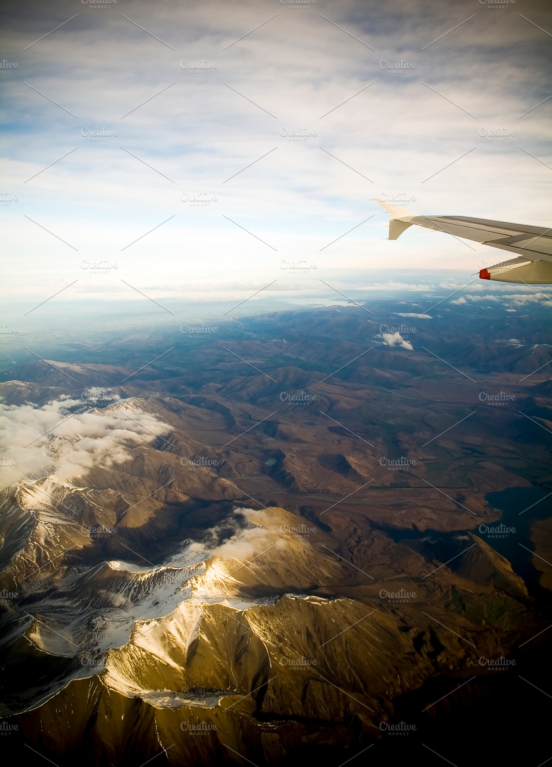 Flying Above Mountains at Sunset, a Nature Photo by THP Creative