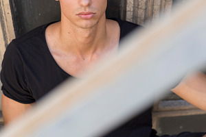 Serious young man posing in sunlight outdoors, a Person Photo by RF Images