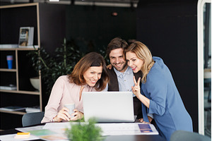 Business colleagues sharing screen, a Business Photo by HalfPoint