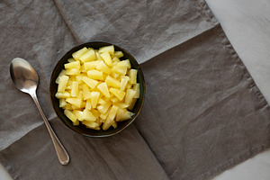 Canned Pineapple Tidbit Chunks in a Bowl, top view. Space for te, a Food & Drink Photo by LiudmylaChuhunova