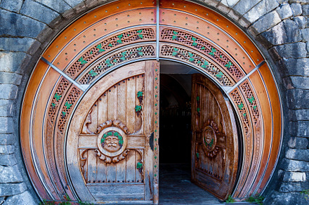 round wooden door to the wine cellar, an Abstract Photo by Photostock