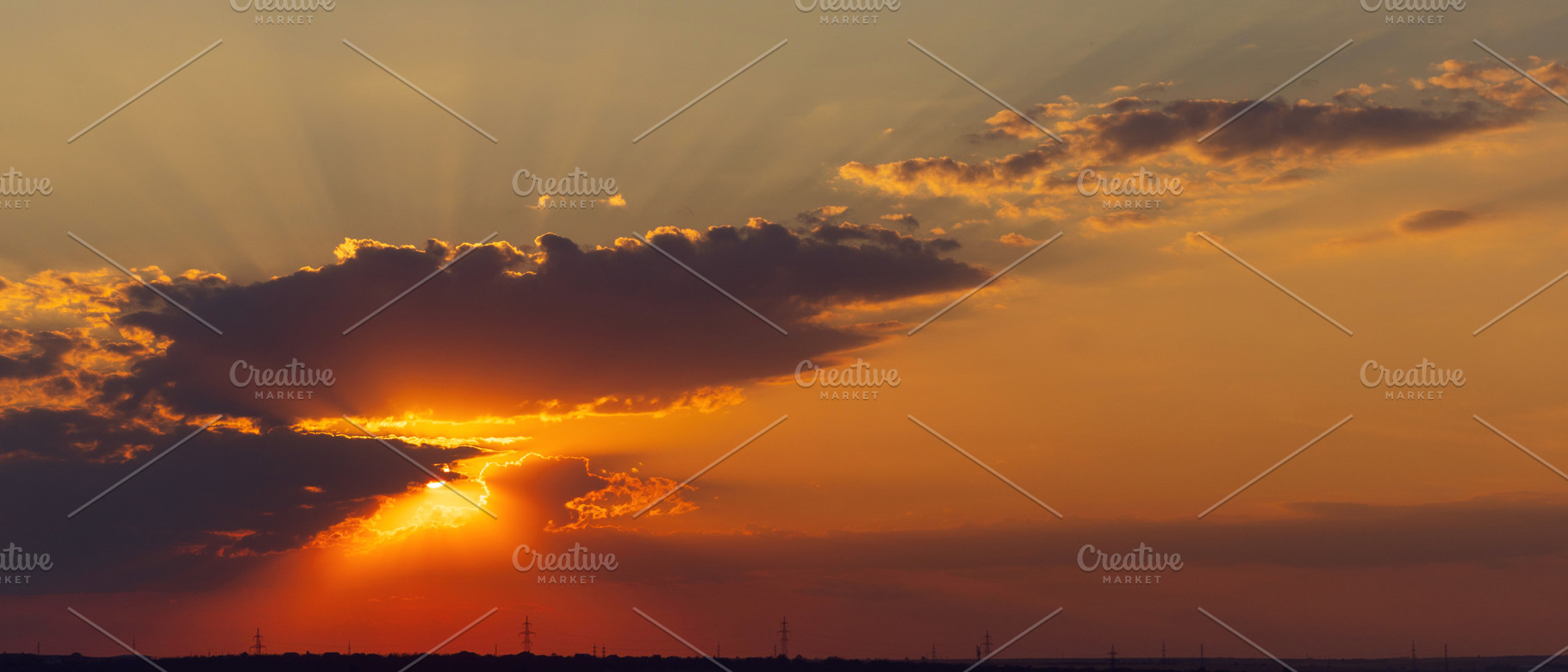 Dramatic sunset sky with sun rays an, a Wallpaper Photo by Elena Vagengeim