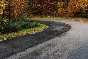 Wet Road on a Sharp Curve Through Au, a Transportation Photo by Perpis