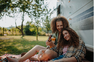 Couple sitting by caravan, enjoying, a Person Photo by HalfPoint