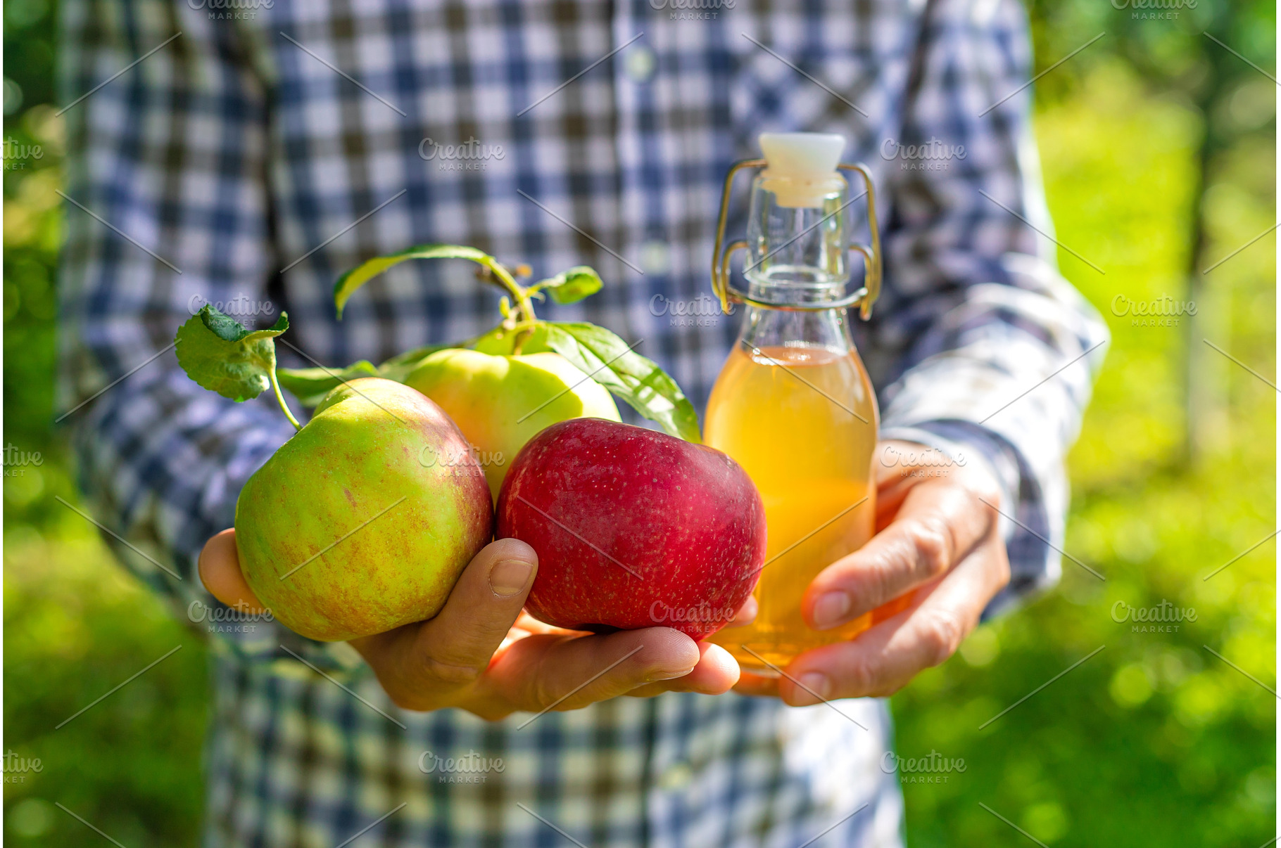 Apple cider vinegar against a, a Food & Drink Photo by yanadjana