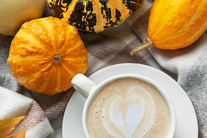 Warm coffee with latte art and autumn pumpkins, a Holiday Photo by Olena Rudo