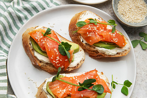 Bruschetta with salmon, avocado, and cream cheese, a Food & Drink Photo by Olena Rudo