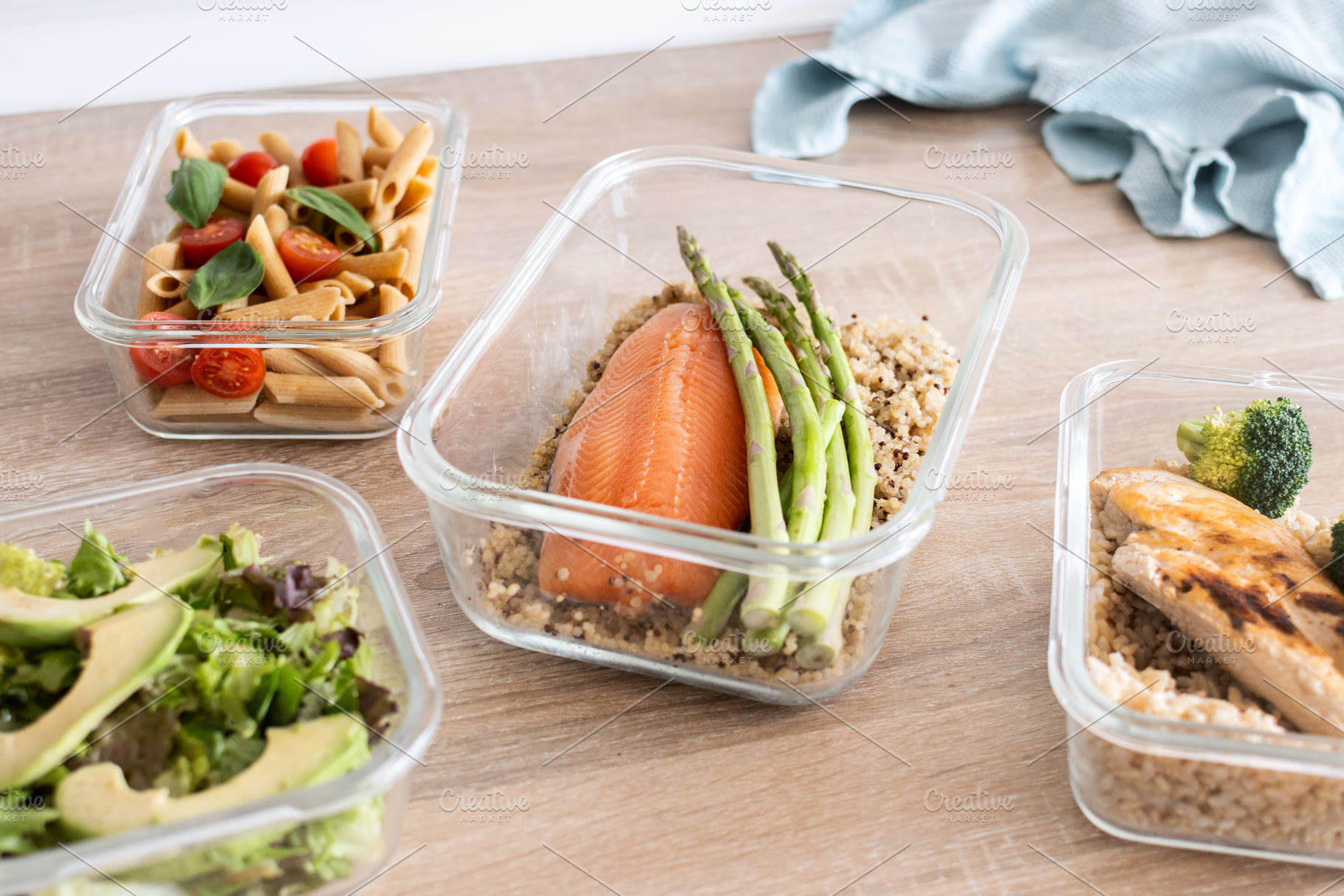 Healthy meal prep containers with salmon, chicken, pasta and fresh vegetables, a Food & Drink Photo by etorres69