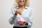 Savings and investment concept. Businesswoman putting money in pink piggy bank,, a Photo by Prostock-Studio (Thumbnail 3 of 3)