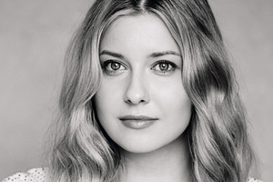 Portrait of a serene young woman with soft wavy blonde hair and, a Person Photo by Studio ANNA