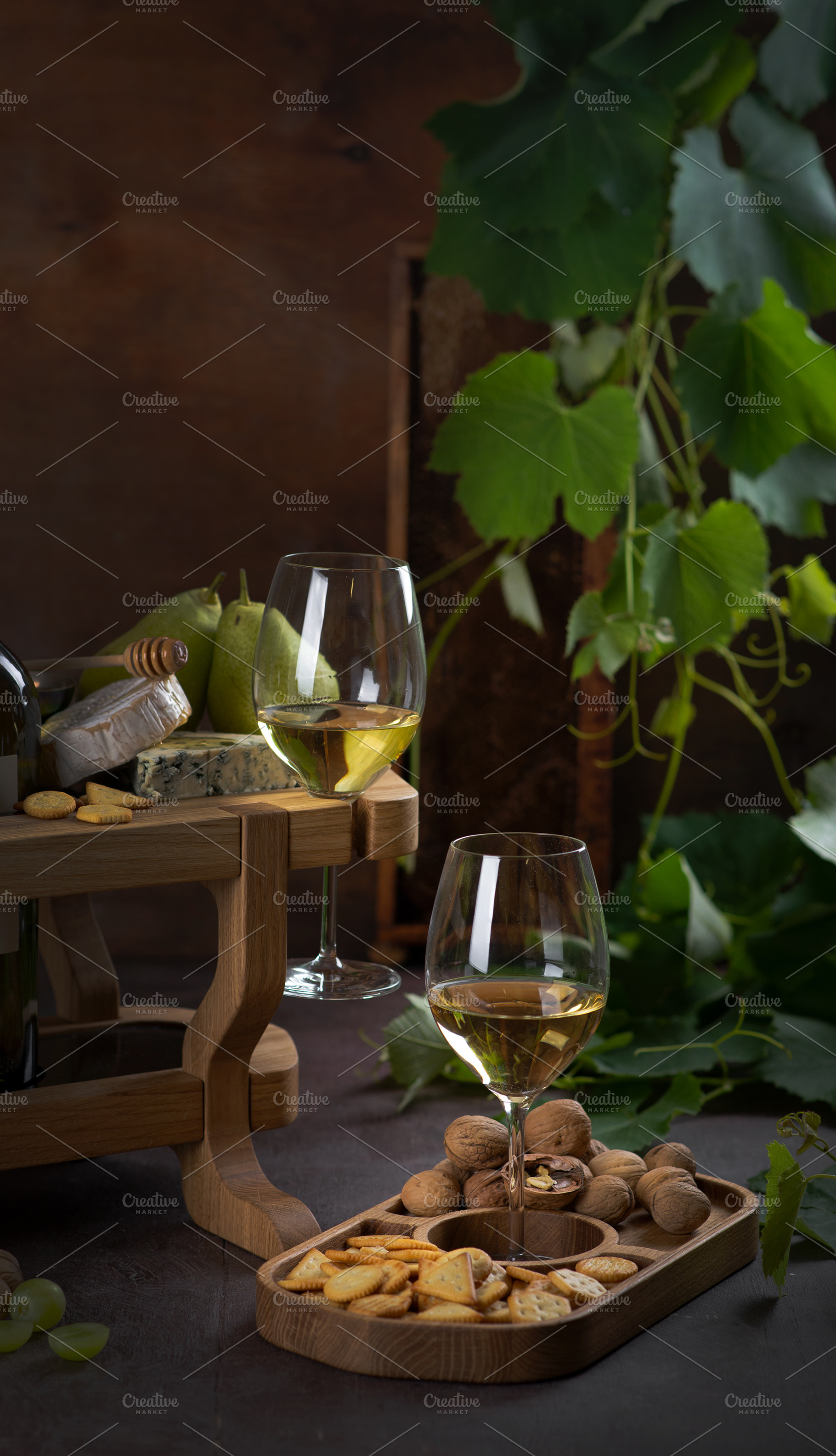 White wine in glasses, pear, cheese, a Food & Drink Photo by nafood