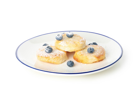 Concept of tasty sweet food, cheese pancakes, isolated on white, a Food & Drink Photo by AtlasStudio PRO