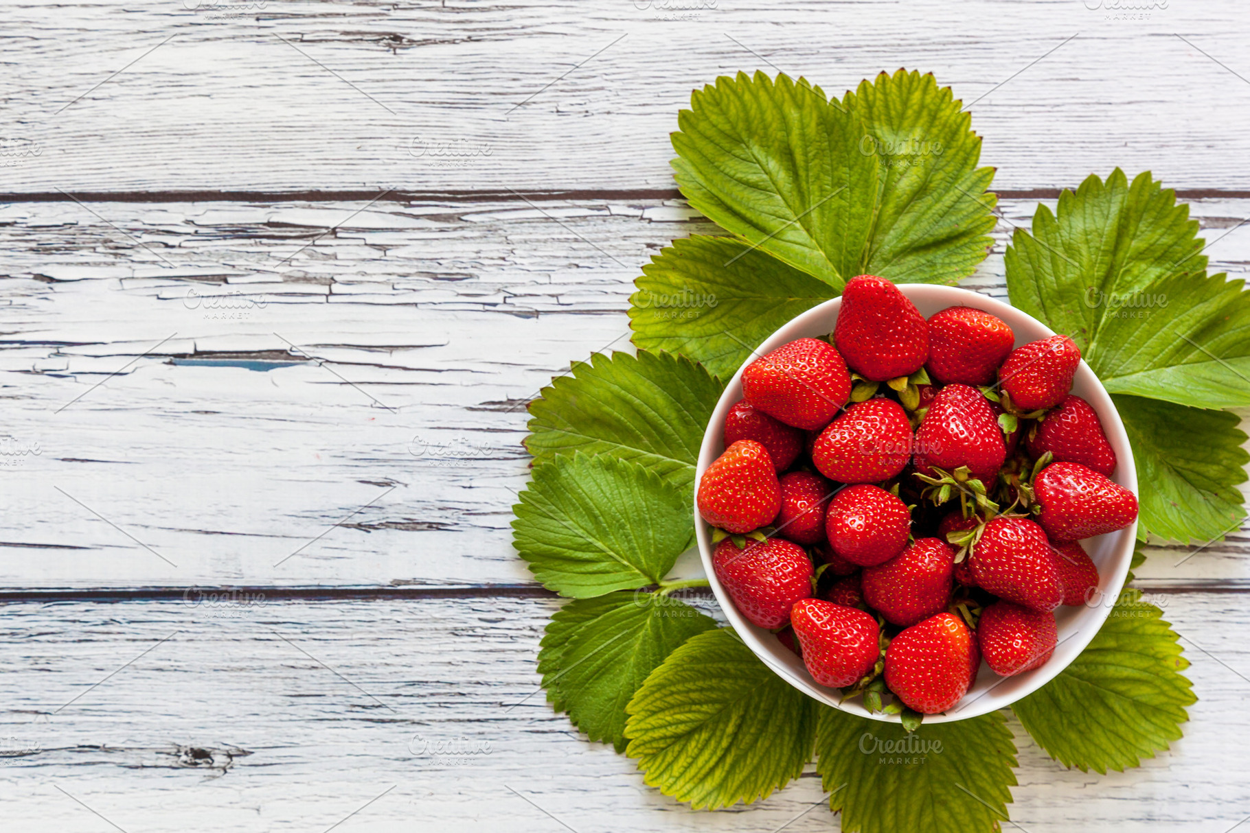 Ripe red strawberries in a white cup, a Food & Drink Photo by Photostock