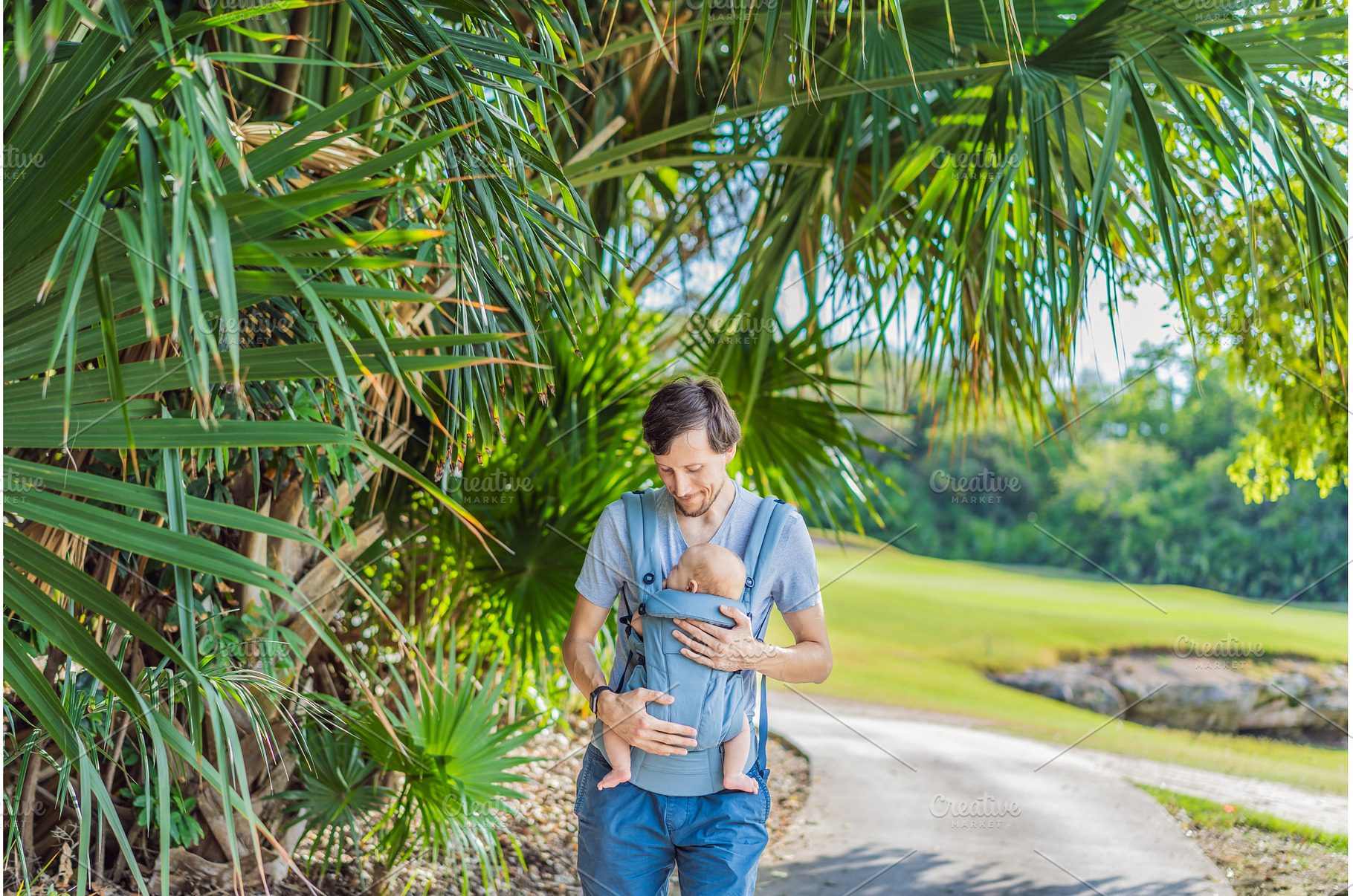 Young father walks in nature with, a Person Photo by Elizaveta Galitskaya