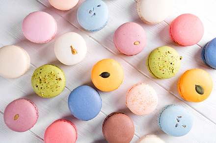 Traditional colorful french macarons containing macaroon, macaron, and sweet, a Food & Drink Photo by YuMyart