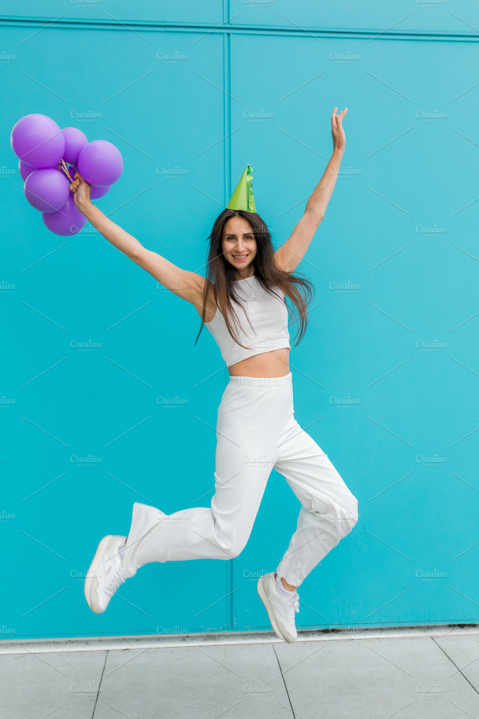 Joyful woman jumping in the air, a Beauty & Fashion Photo by Kolomiyets Viktoriya