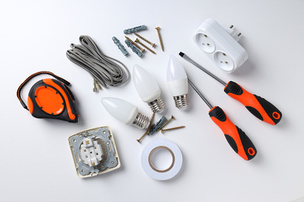 Concept of electrician or electrical tools on white background, an Industrial Photo by AtlasStudio PRO