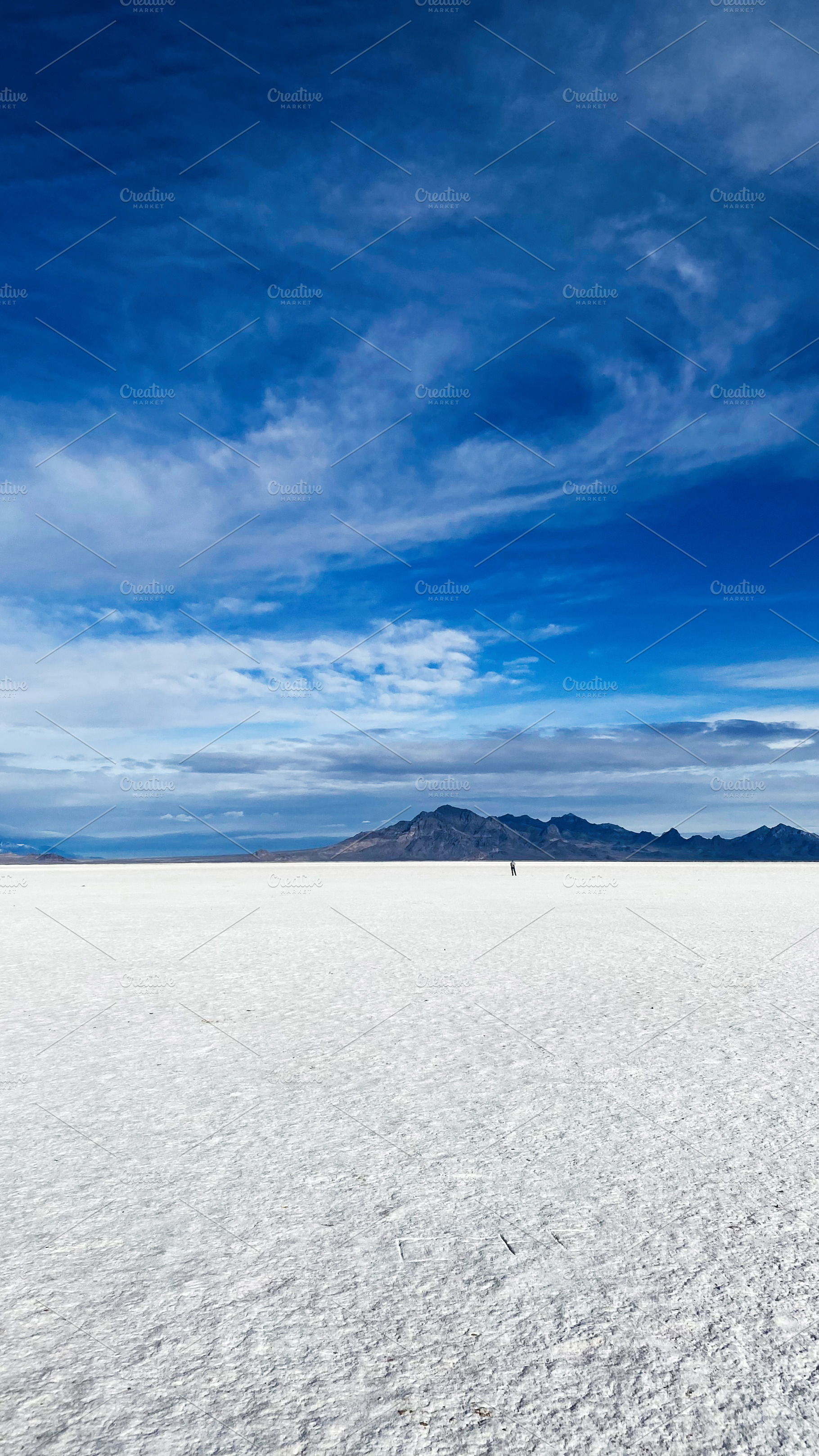Salt flat landscape in Utah with blue sky, distant mountains, and expansive hor, a Nature Photo by AS photostudio