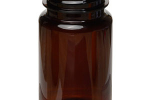 An empty open bottle of dark brown glass without a lid on an iso, a Health & Medical Photo by ndanko