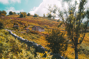 Asturias hillside with stone house, an Architecture Photo by SkyNext