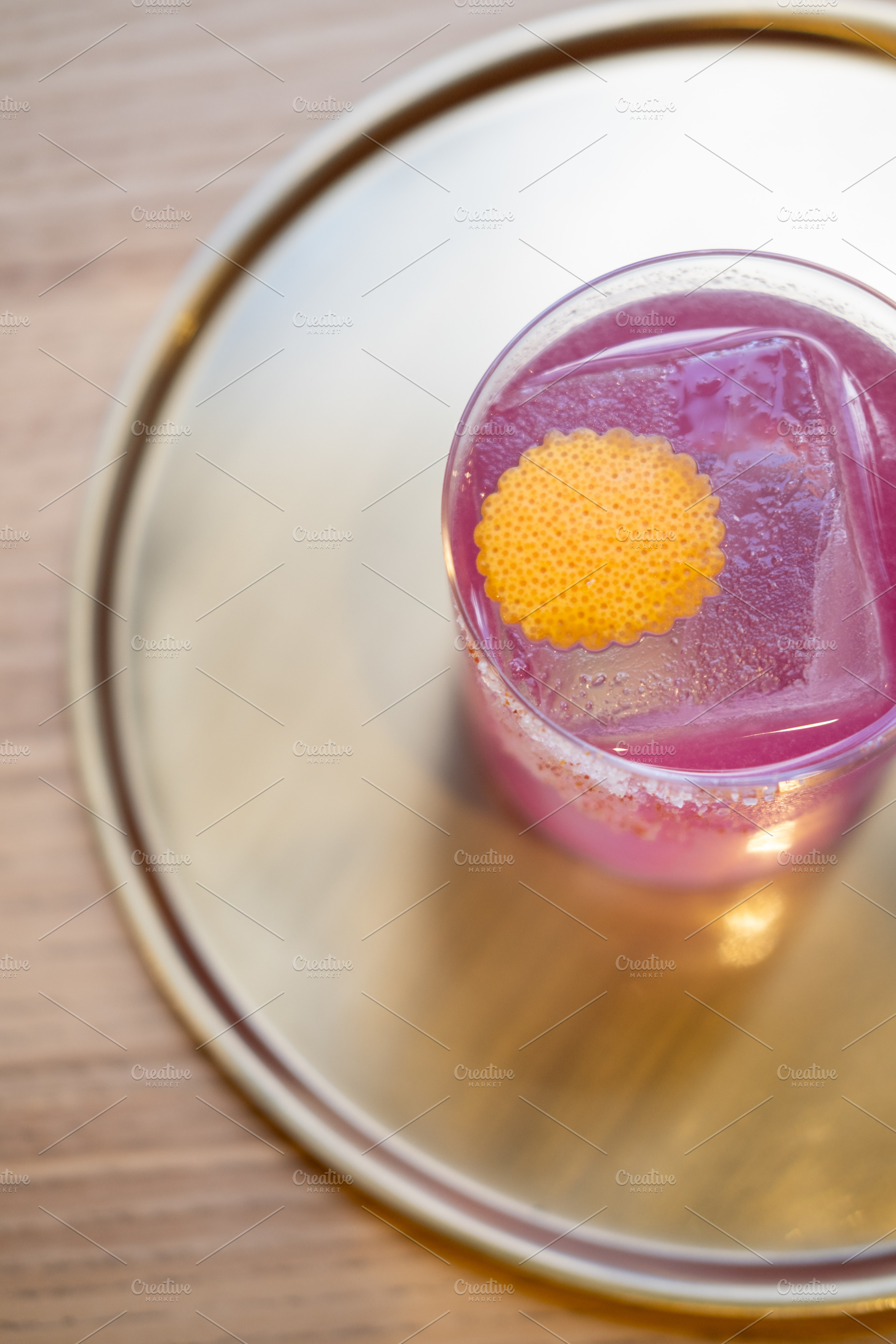 Pink cocktail cold beverage ice glass citrus tray, a Food & Drink Photo by Photo Drive Studio