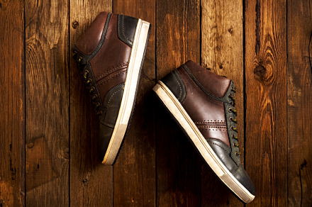 Leather boots on the wooden floor stock photo containing hiking and isolated, a Beauty & Fashion Photo by photoWorkshop