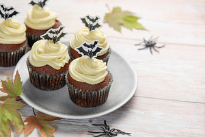 Halloween cupcakes with bat toppers and autumn leaves, a Food & Drink Photo by Olena Rudo