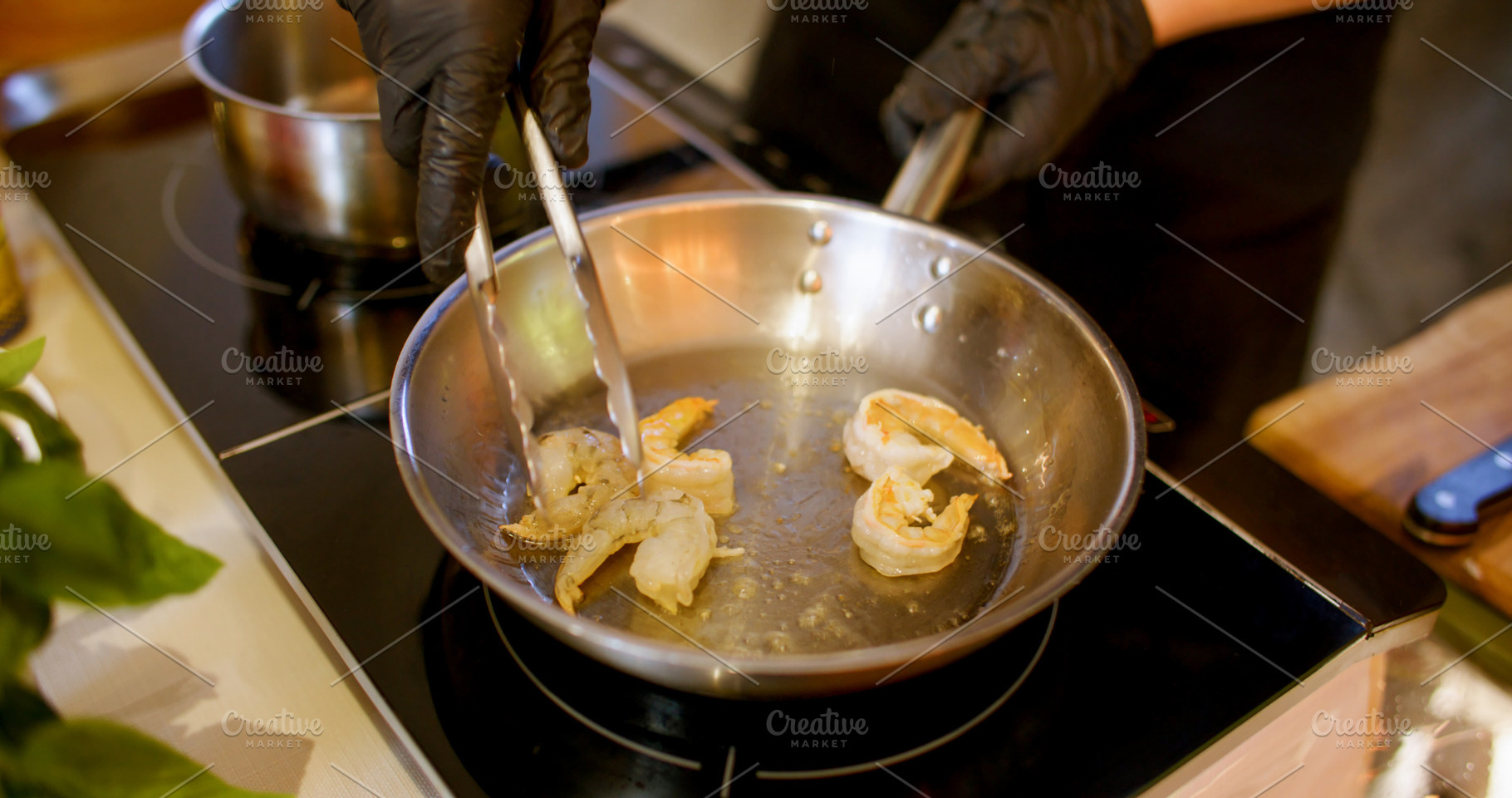 Preparing prawn seafood recipe chef oil pan hand, a Food & Drink Photo by Photo Drive Studio