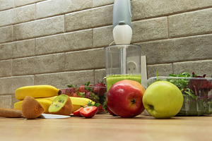 Preparing a healthy green smoothie with fresh fruits, a Food & Drink Photo by Olena Rudo