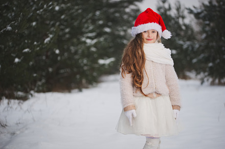 Little happy beautiful girl in stock photo containing winter and snow
