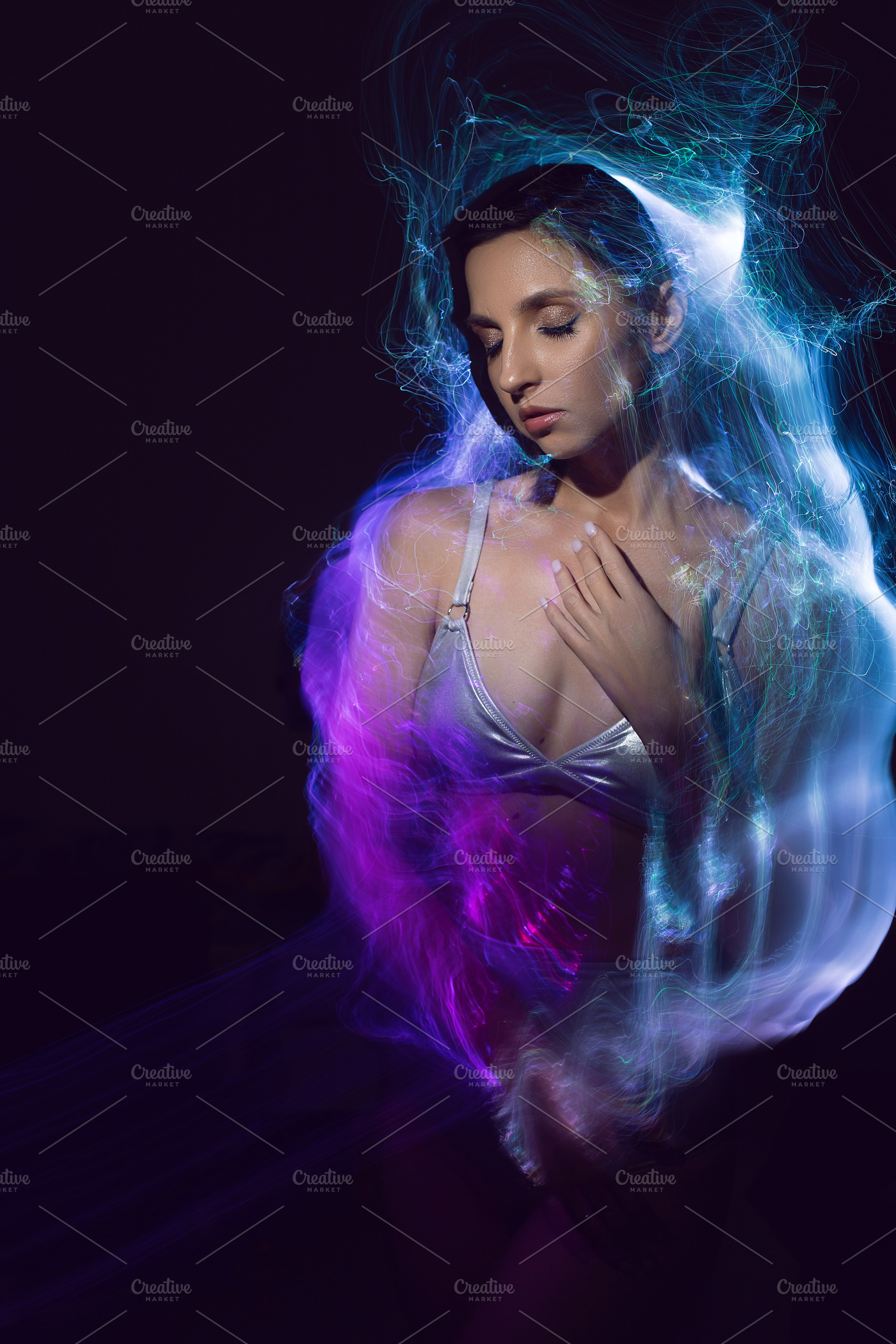 portrait cyber futuristic elegant lady in a silver swimsuit vogue look isolated, a Person Photo by SaulichPhoto