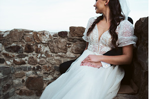 Bride is sitting on the groom's lap., a Person Photo by HalfPoint
