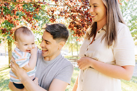Portrait of a young family with their nine month old baby