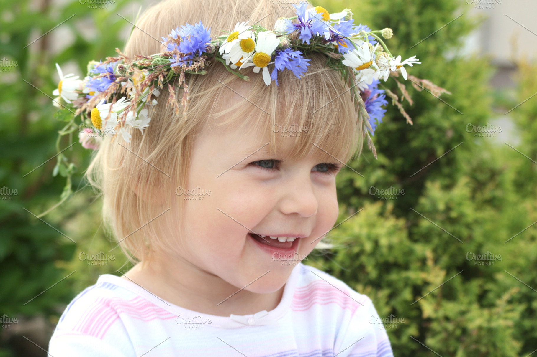 Smiling girl with flower wreath, a Person Photo by BOOCYS