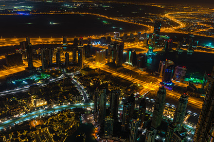 Dubai downtown night scene with city lights, an Architecture Photo by Dvoevnore photos