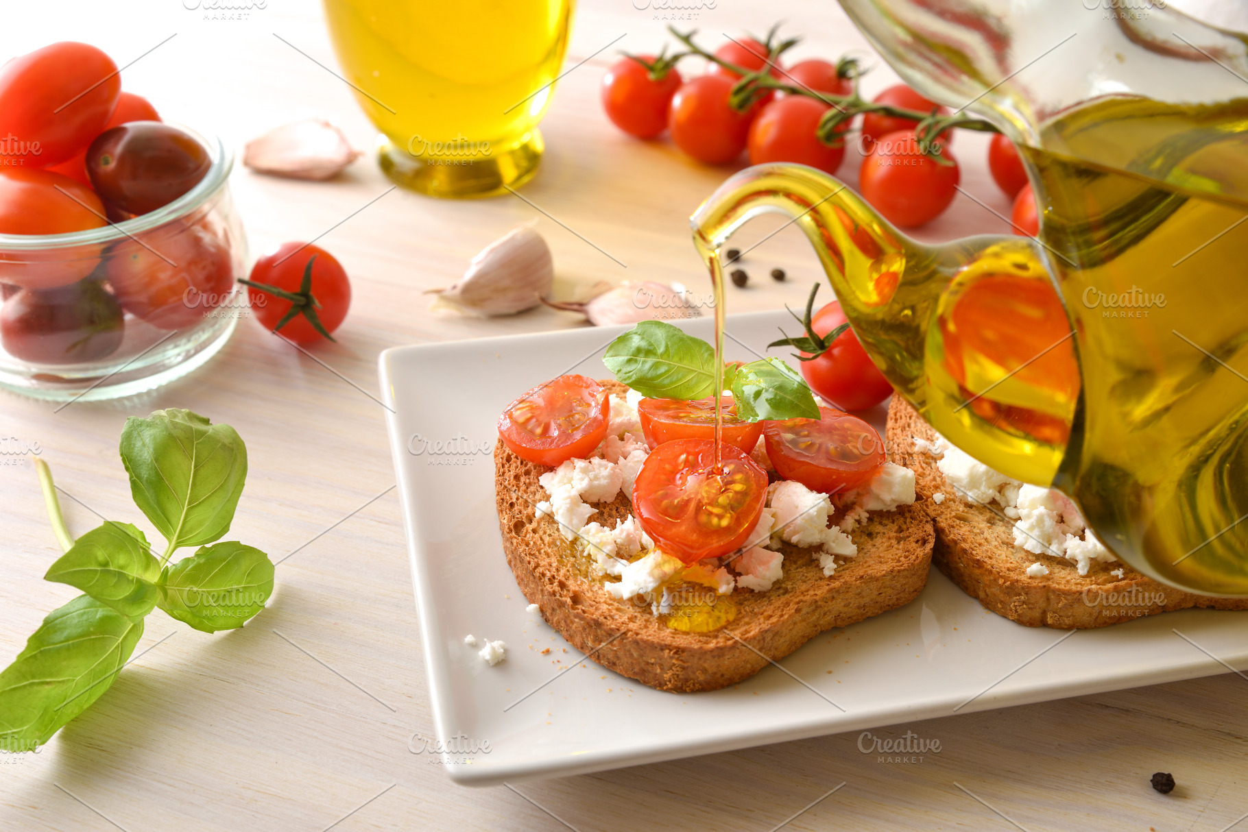 Olive Oil Drizzled Over Tomato Feta Toast, a Food & Drink Photo by Davizro's Market