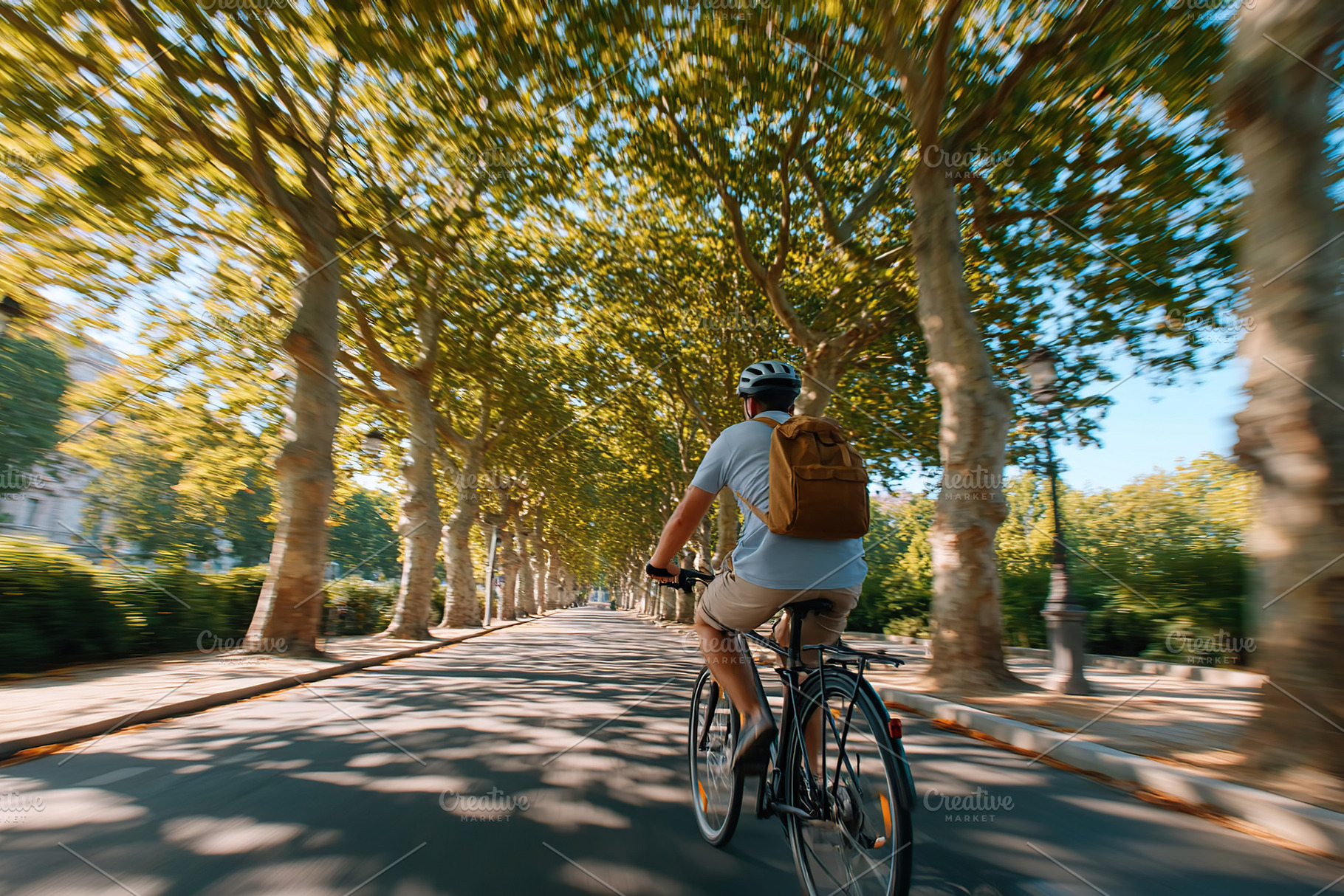 Exploring a serene tree-lined city street while riding a bicycle during a sunny, a Photo by AlyaAnd