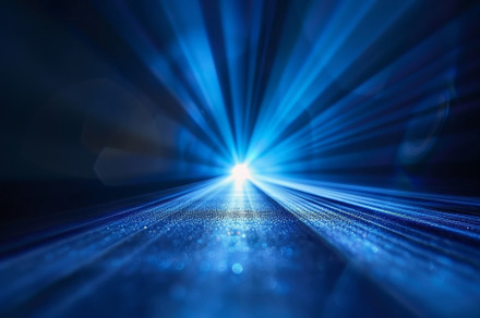 Vivid blue rays radiate outward from, a Photo by Tanuart