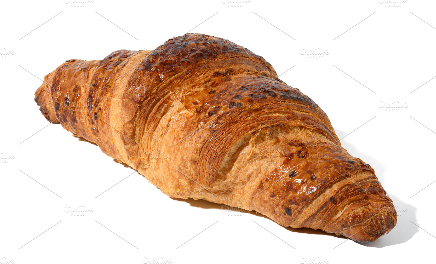 Baked croissant on a white isolated background, a Food & Drink Photo by ndanko