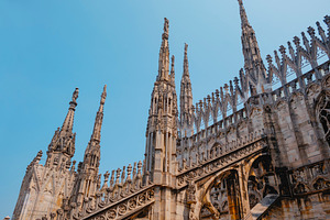 gothic spires on the rooftop of Milan Cathedral, a Photo by Nito